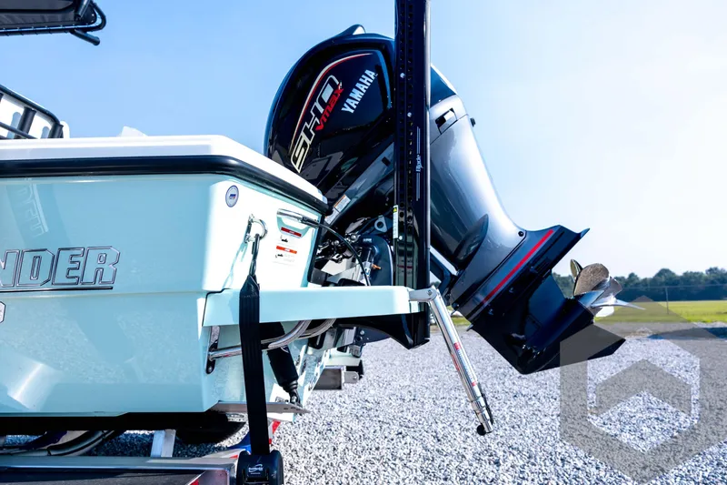 Slide: The Image of 2026 Pathfinder 2200 TRS boat with Yamaha outboard motor on gravel surface. - 25
