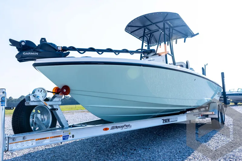 Slide: The Image of 2026 Pathfinder 2200 TRS boat on trailer with Garmin equipment, outdoor setting. - 31