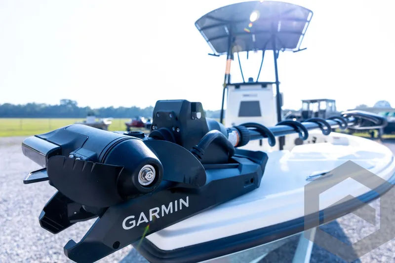Slide: The Image of 2026 Pathfinder 2200 TRS boat with Garmin equipment, outdoor setting. - 32