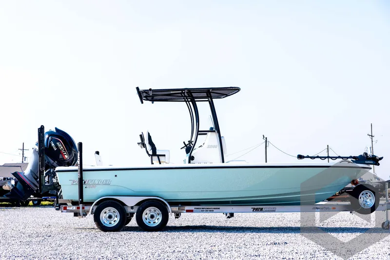 Slide: The Image of 2026 Pathfinder 2200 TRS boat on trailer, side view, outdoors. - 4