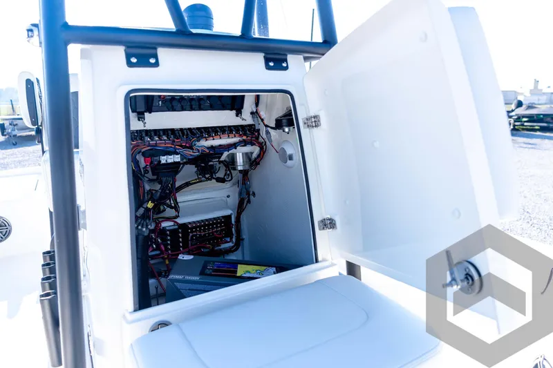 Slide: The Image of Open electrical compartment of 2026 Pathfinder 2200 TRS boat, showcasing wiring and components. - 49