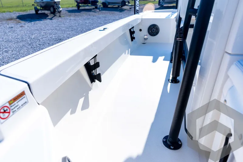 Slide: The Image of 2026 Pathfinder 2200 TRS boat interior with rod holders and clean white deck. - 50