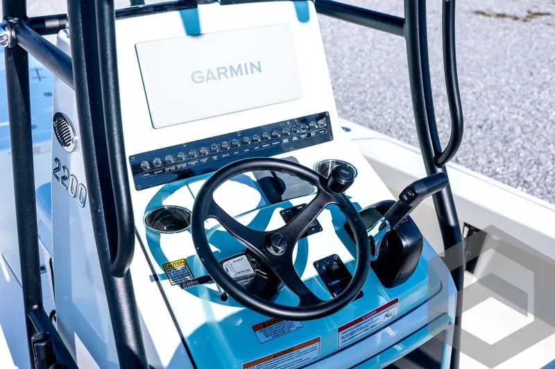 Slide: The Image of Steering console of 2026 Pathfinder 2200 TRS boat with Garmin navigation system. - 54