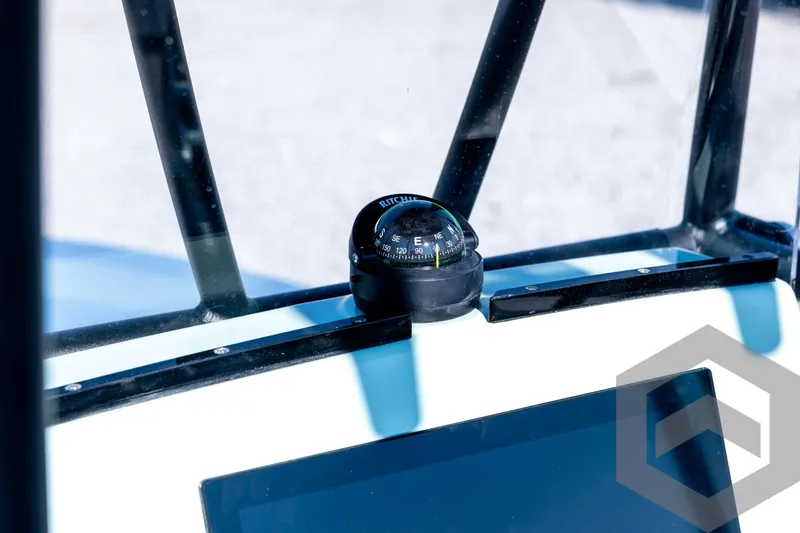 Slide: The Image of Compass on 2026 Pathfinder 2200 TRS boat dashboard, close-up view. - 56