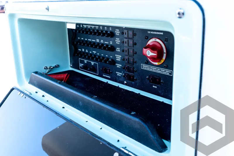 Slide: The Image of Control panel of 2026 Pathfinder 2200 TRS boat, featuring switches and emergency settings. - 59