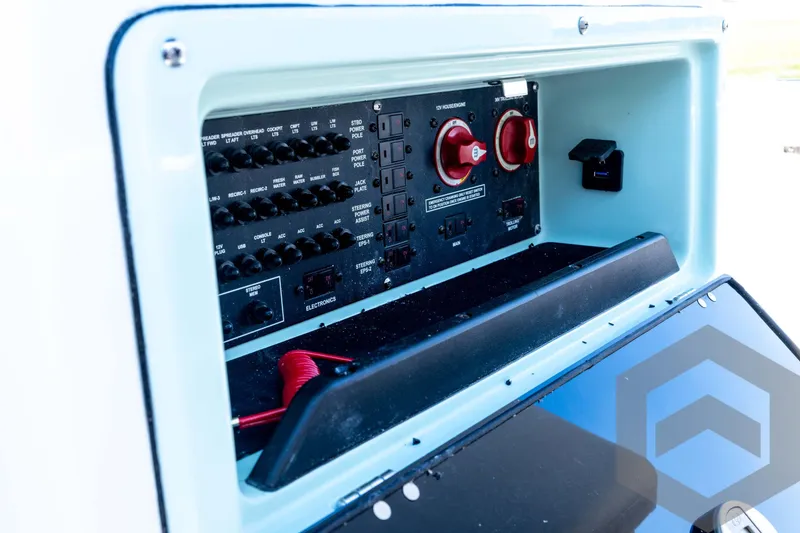 Slide: The Image of Electrical panel of 2026 Pathfinder 2200 TRS boat with switches and controls. - 60