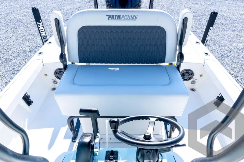 Slide: The Image of 2026 Pathfinder 2200 TRS boat interior with steering wheel and seating. - 61