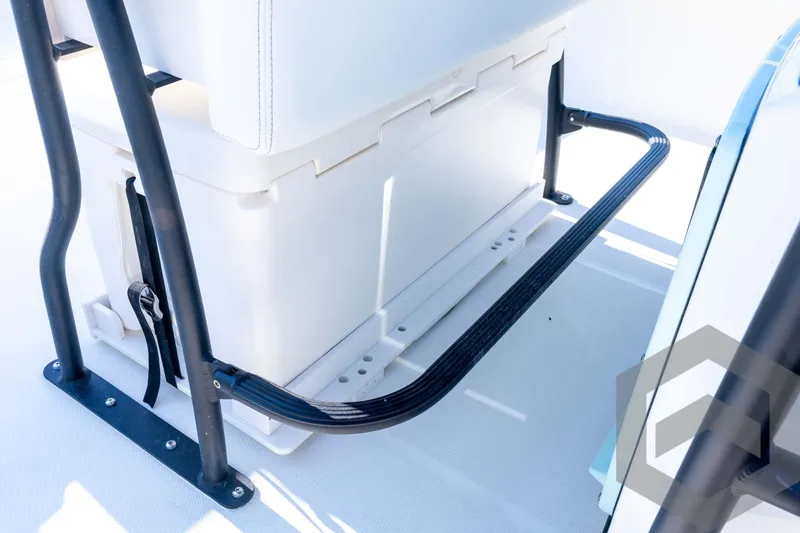 Slide: The Image of 2026 Pathfinder 2200 TRS boat interior with cooler and black metal frame. - 65