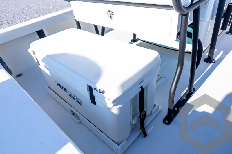 Slide: The Image of 2026 Pathfinder 2200 TRS boat interior with cooler and seating area. - 66