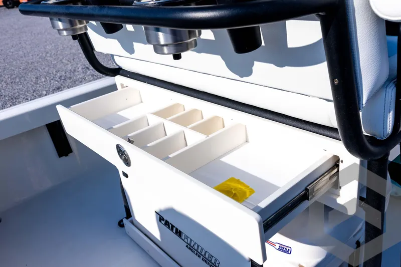 Slide: The Image of Open storage compartment on 2026 Pathfinder 2200 TRS boat, featuring organized sections. - 68