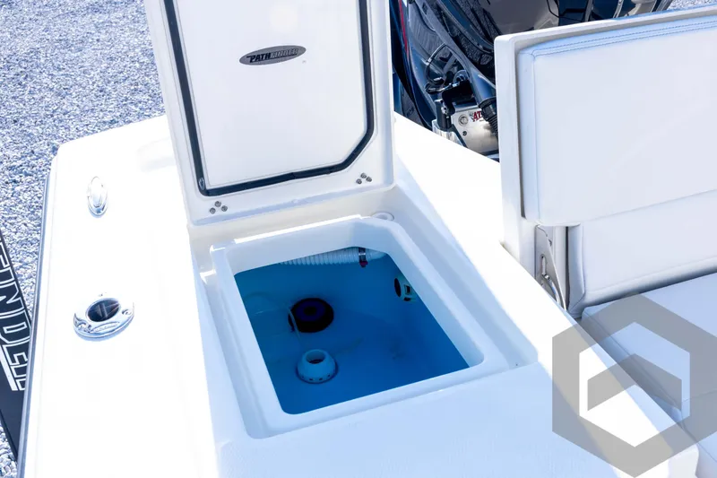 Slide: The Image of 2026 Pathfinder 2200 TRS boat with open storage compartment and seating. - 73