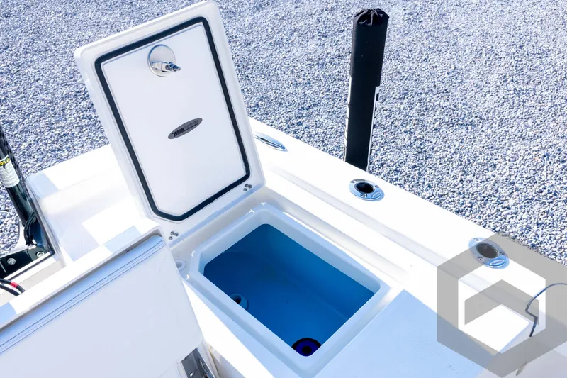 Slide: The Image of Open storage compartment on 2026 Pathfinder 2200 TRS boat, featuring sleek design and functionality. - 74