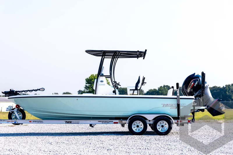 Slide: The Image of 2026 Pathfinder 2200 TRS boat on trailer, side view, outdoors. - 8