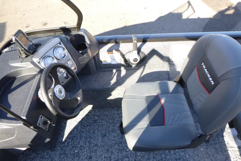 Slide: The Image of 2026 Tracker Pro Guide V-16 WT boat interior with steering wheel and seat. - 10