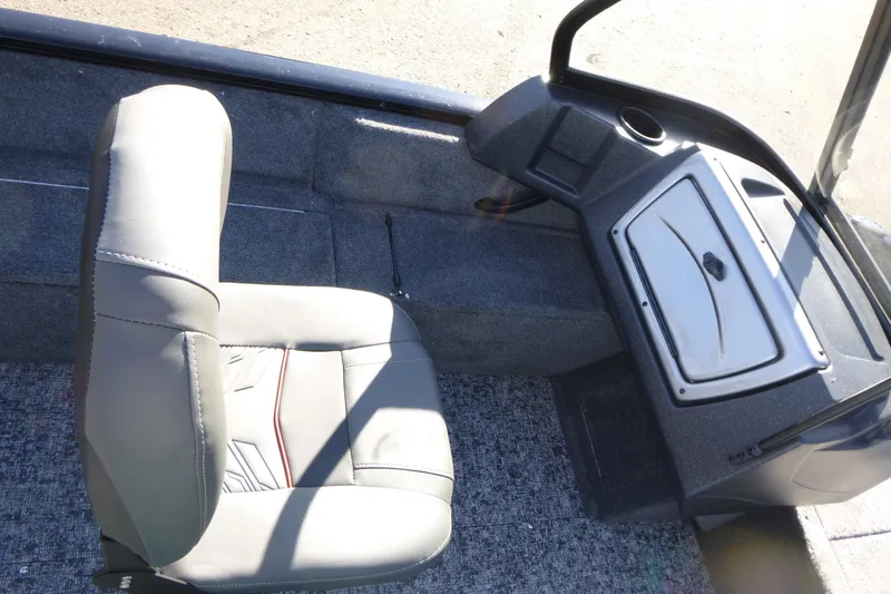 Slide: The Image of 2026 Tracker Pro Guide V-16 WT boat interior with seat and console. - 12
