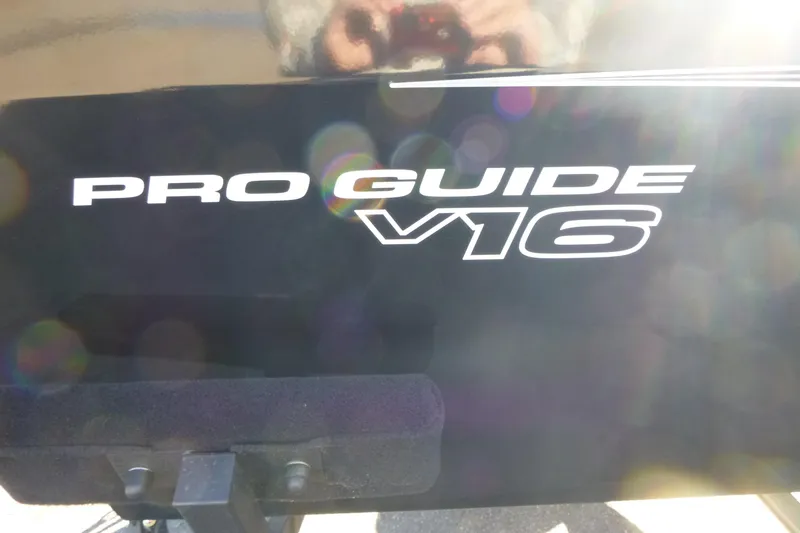 Slide: The Image of 2026 Tracker Pro Guide V-16 WT boat logo with sunlight reflections. - 15
