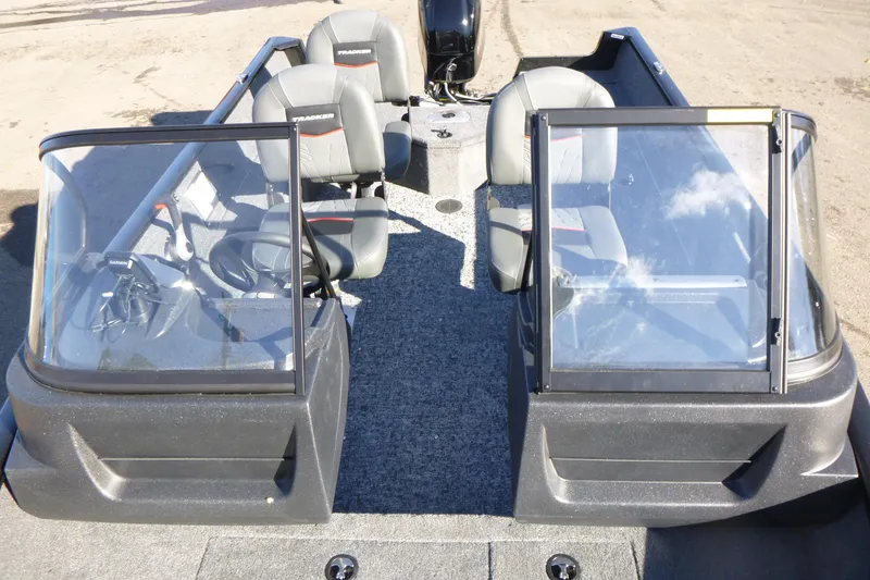 Slide: The Image of 2026 Tracker Pro Guide V-16 WT boat interior with dual consoles and seating. - 5