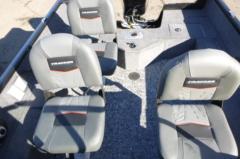 Slide: The Image of 2026 Tracker Pro Guide V-16 WT boat interior with four gray seats. - 9