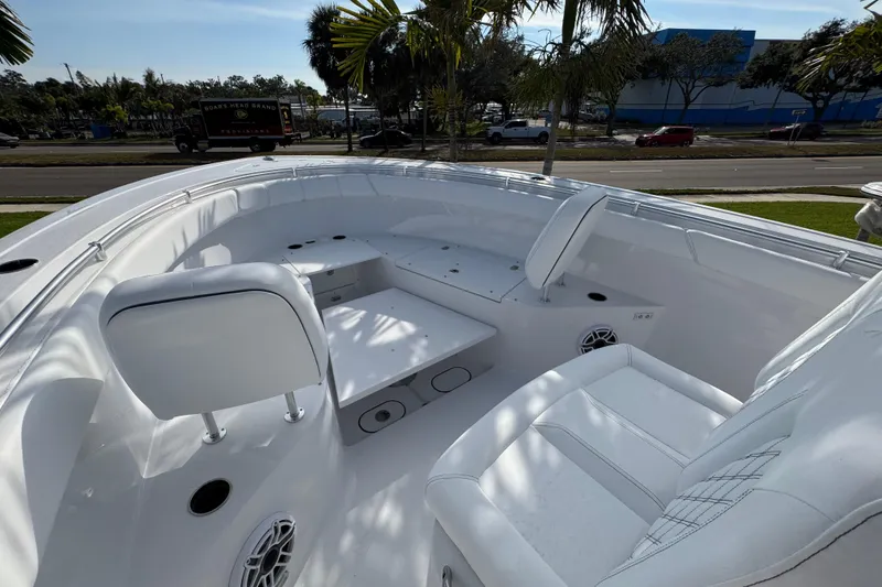 Slide: The Image of 2026 Sportsman Open 302 Center Console boat interior with white seating and modern design. - 14
