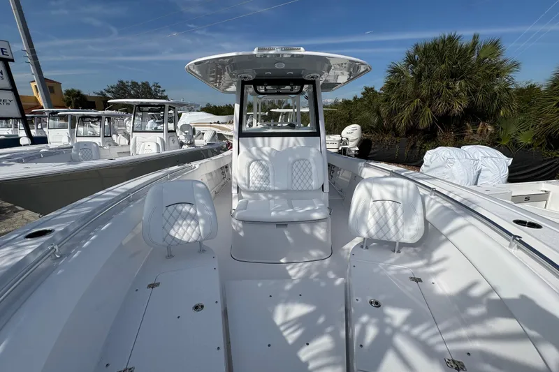 Slide: The Image of 2026 Sportsman Open 302 Center Console boat with sleek design and spacious seating. - 15