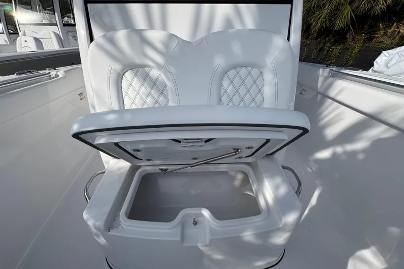 Slide: The Image of 2026 Sportsman Open 302 Center Console with open storage compartment and cushioned seating. - 16