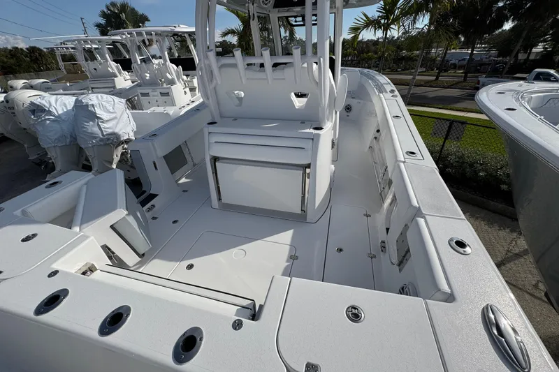 Slide: The Image of 2026 Sportsman Open 302 Center Console boat, spacious deck, modern design, outdoor setting. - 3
