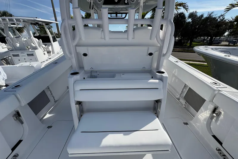 Slide: The Image of 2026 Sportsman Open 302 Center Console boat interior with seating and storage. - 7