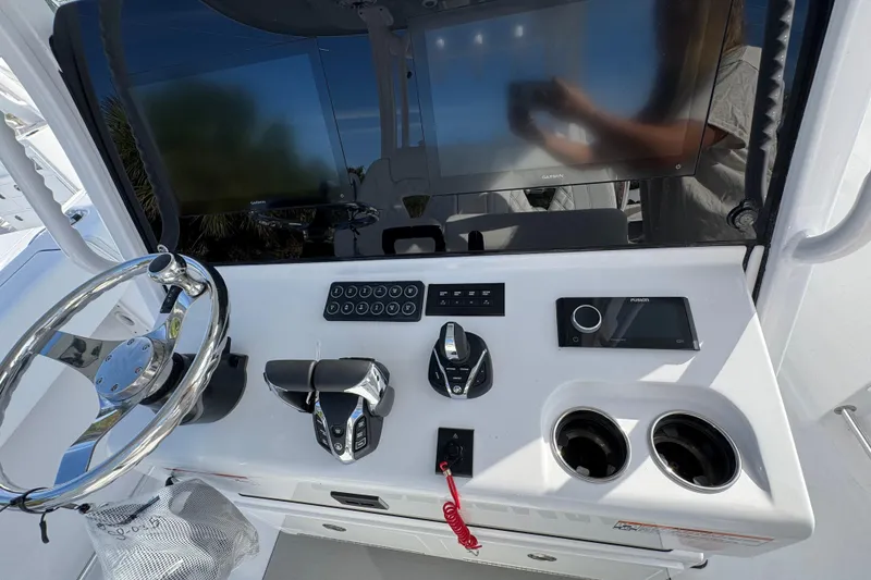 Slide: The Image of 2026 Sportsman Open 302 Center Console dashboard with steering wheel, controls, and display screen. - 9