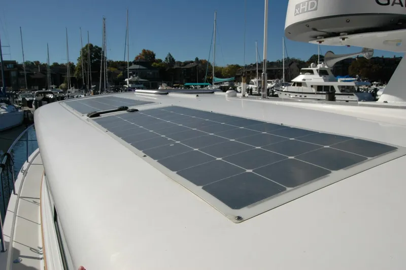 Slide: The Image of 2015 Back Cove 37 yacht with solar panels on deck, docked in marina. - 16
