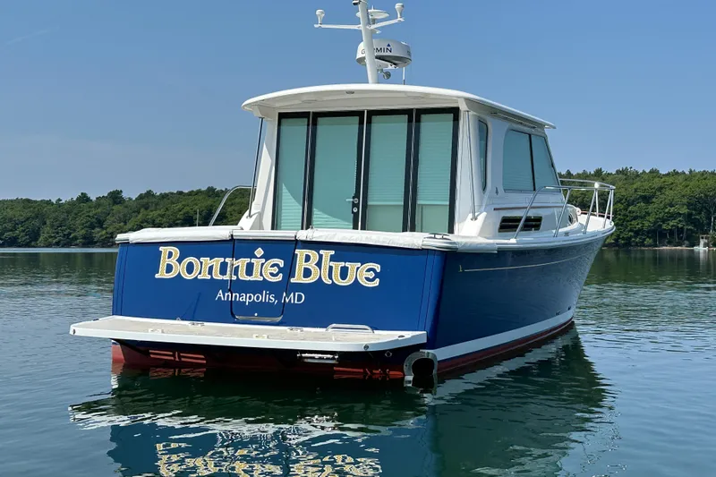 Slide: The Image of 2015 Back Cove 37 boat named "Bonnie Blue" on calm water, Annapolis, MD. - 2