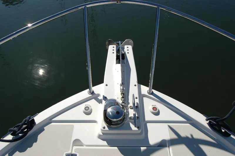 Slide: The Image of Bow of 2015 Back Cove 37 boat with anchor and railing in sunlight. - 25