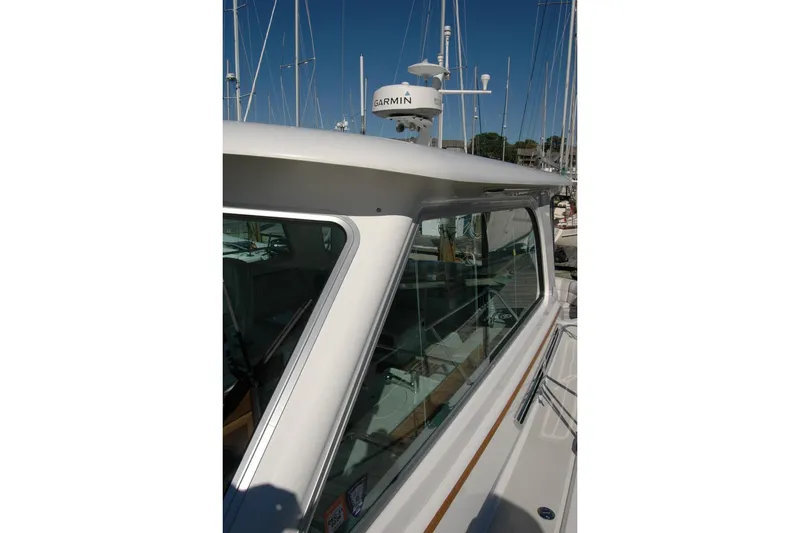 Slide: The Image of 2015 Back Cove 37 boat with Garmin radar, docked in a marina. - 28