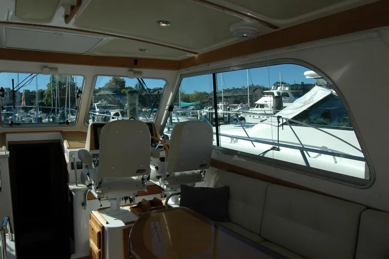 Slide: The Image of Interior view of 2015 Back Cove 37 yacht with marina background. - 37