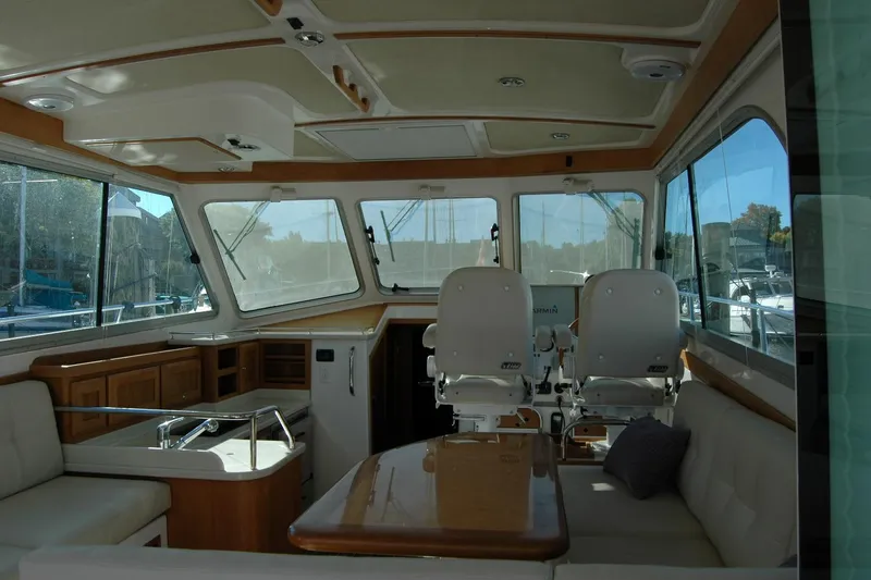 Slide: The Image of Interior of 2015 Back Cove 37 yacht with seating and helm station. - 43