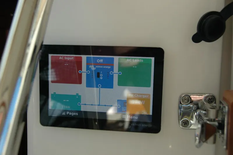 Slide: The Image of Control panel display on 2015 Back Cove 37 boat showing power management. - 52