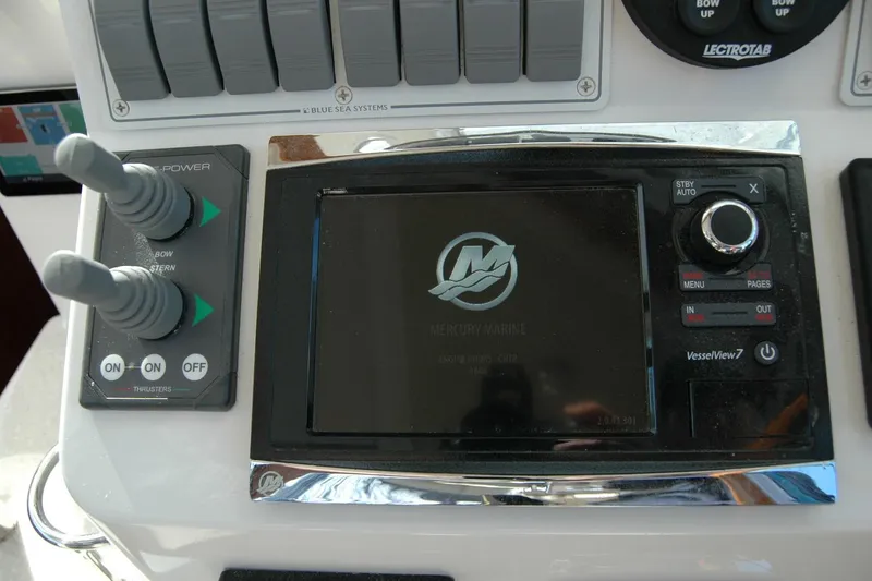 Slide: The Image of Control panel of a 2015 Back Cove 37 boat with Mercury Marine display. - 55
