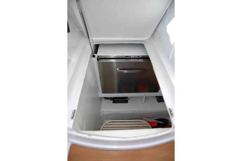 Slide: The Image of 2015 Back Cove 37 boat storage compartment with stainless steel appliance. - 58