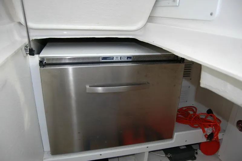Slide: The Image of Stainless steel refrigerator in 2015 Back Cove 37 boat interior. - 59