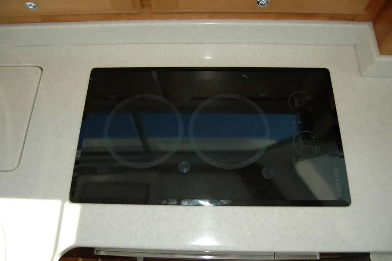 Slide: The Image of Stovetop on 2015 Back Cove 37 yacht, featuring sleek black glass design. - 62