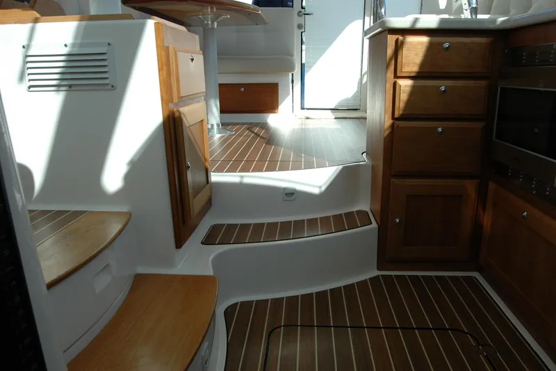 Slide: The Image of Interior of 2015 Back Cove 37 yacht with wooden cabinetry and steps. - 66