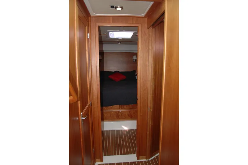 Slide: The Image of 2015 Back Cove 37 yacht interior with wood finish and cozy bedroom. - 68