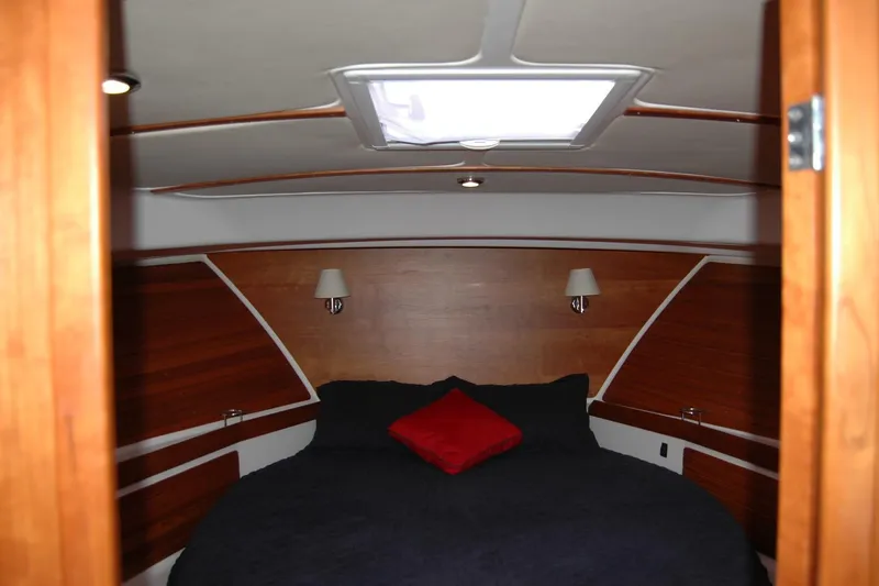 Slide: The Image of Cozy cabin interior of 2015 Back Cove 37 yacht with wood paneling and skylight. - 72