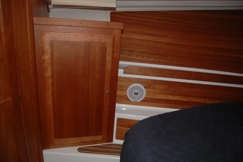 Slide: The Image of Interior of 2015 Back Cove 37 yacht with wooden paneling and speaker. - 79