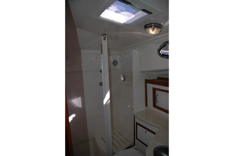 Slide: The Image of 2015 Back Cove 37 yacht bathroom with shower, skylight, and modern fixtures. - 81