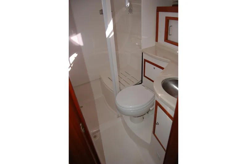 Slide: The Image of 2015 Back Cove 37 yacht bathroom with shower, toilet, and sink. - 83