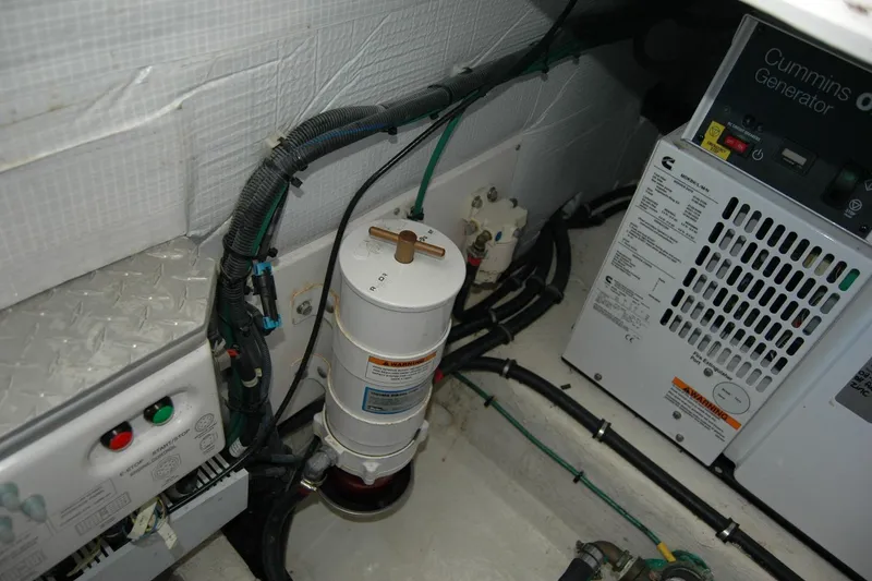 Slide: The Image of Engine room of 2015 Back Cove 37 with Cummins generator and wiring. - 88