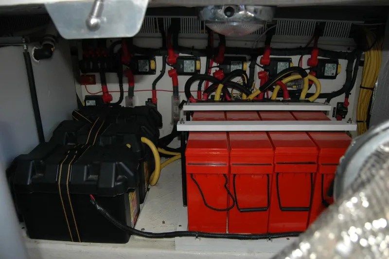 Slide: The Image of Engine room of 2015 Back Cove 37 with batteries and wiring. - 95