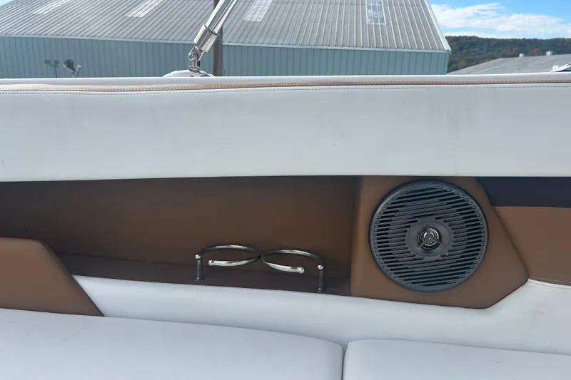Slide: The Image of Interior of 2022 Four Winns HD2 OB boat with speaker and cup holders. - 12
