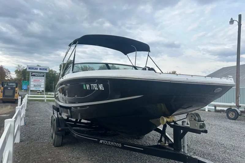Slide: The Image of 2022 Four Winns HD2 OB boat on trailer at Morgan Marine dealership. - 3