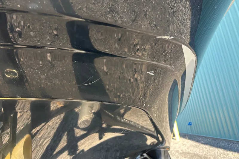 Slide: The Image of Close-up of 2022 Four Winns HD2 OB boat hull with minor scratches. - 30